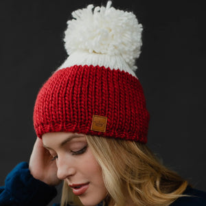 turning red pom hat